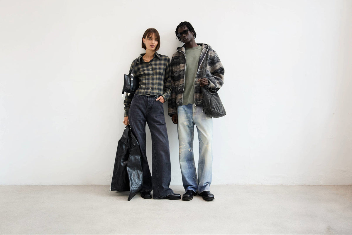 Two models wear a minimal, capsule wardrobe
