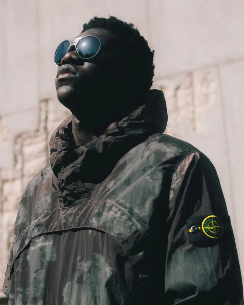 Model wearing Stone Island Camo jacket.