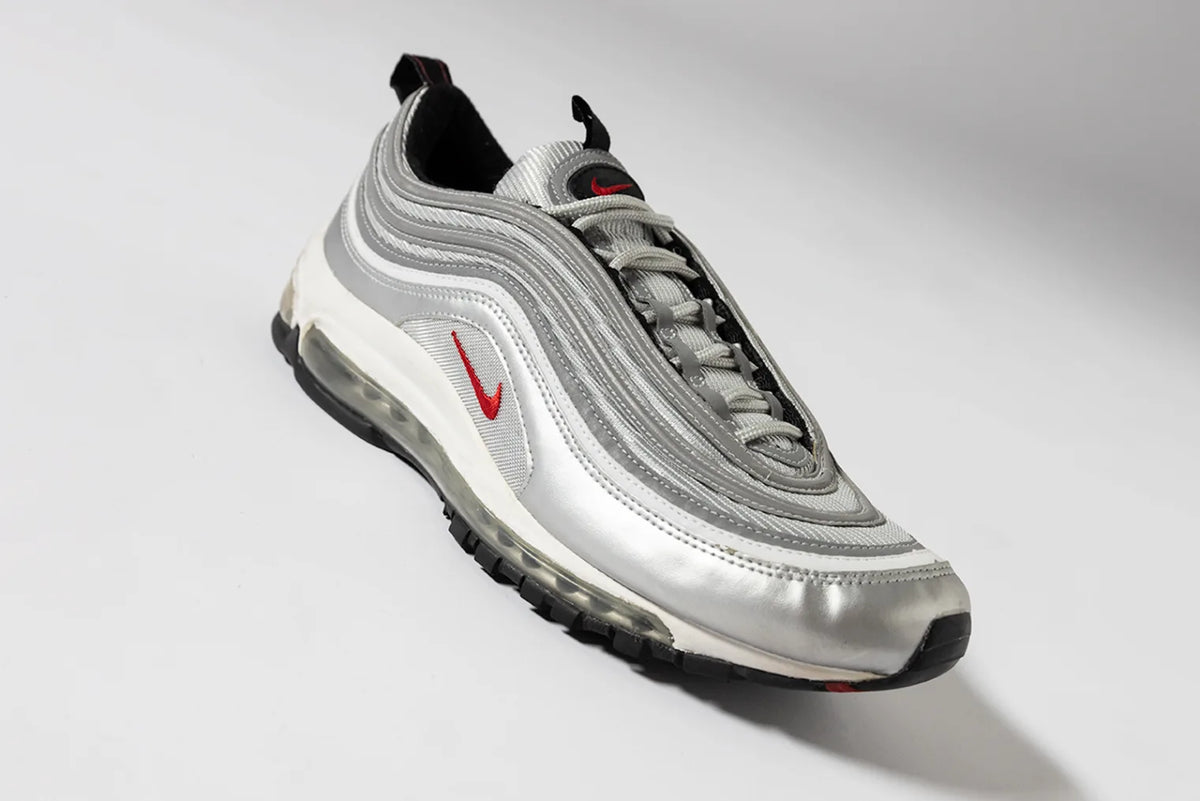 The Nike Air Max 97 OG 'Silver Bullet' sneakers.