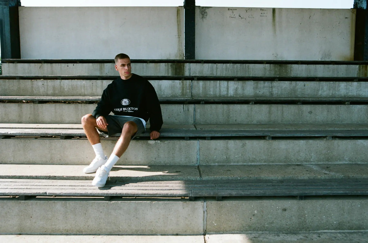 Man wearing Cole Buxton sweatshirt