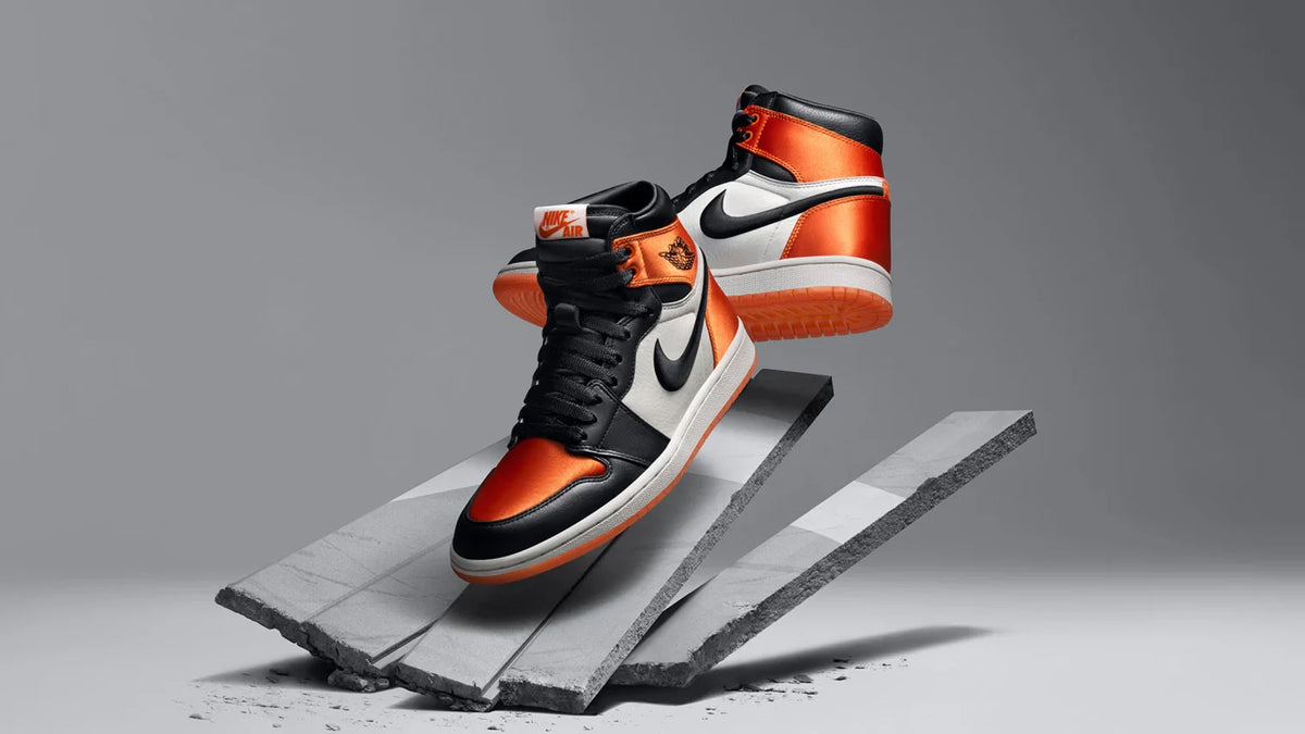 The Nike Air Jordan 1 Retro High OG 'Satin Shattered Backboard' sneakers.