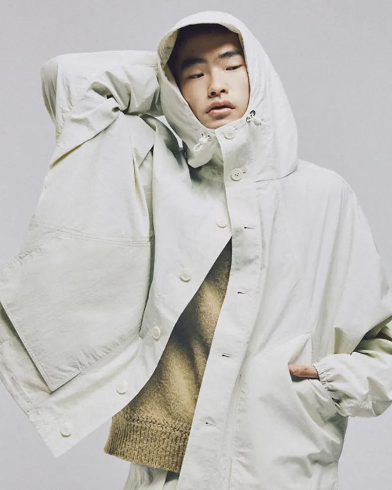 A model wears the YMC Bonehead jacket in white