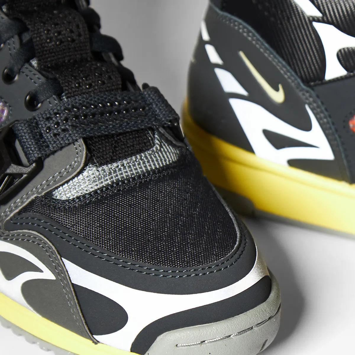 Close‑up detail of the Nike Air Trainer 1 SP sneaker, highlighting the toebox and layered panel construction.