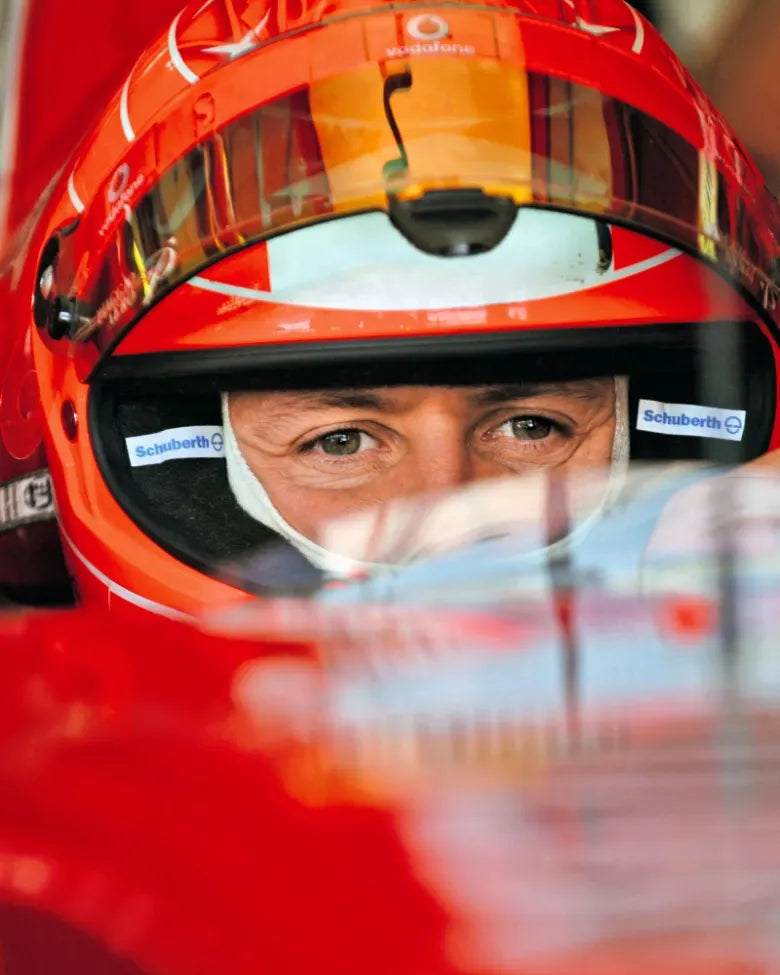 A close-up image of Michael Schumacher while driving