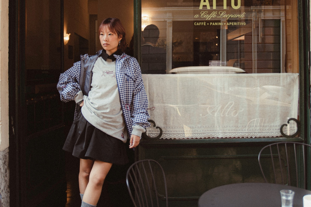 A model wearing the Damson Madder Matilda Jacket in blue