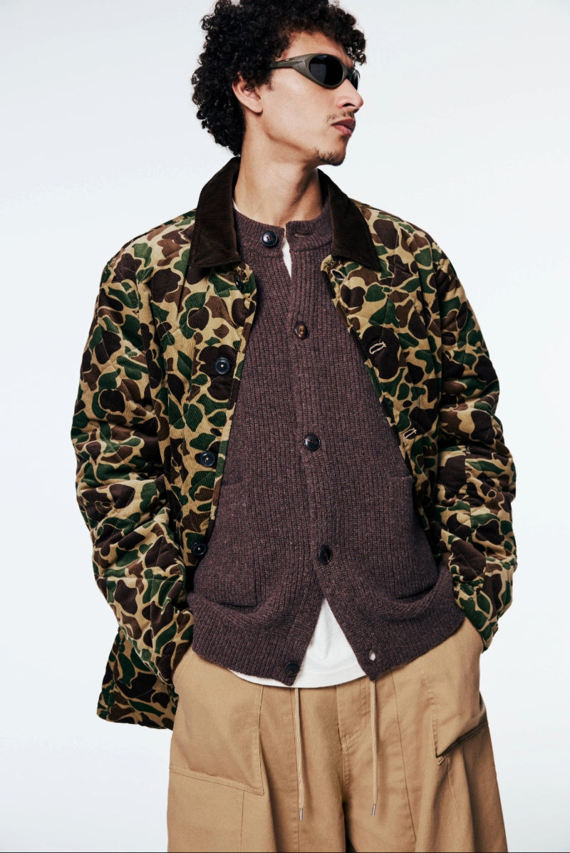 A model wears a camouflage Ralph Lauren Jacket