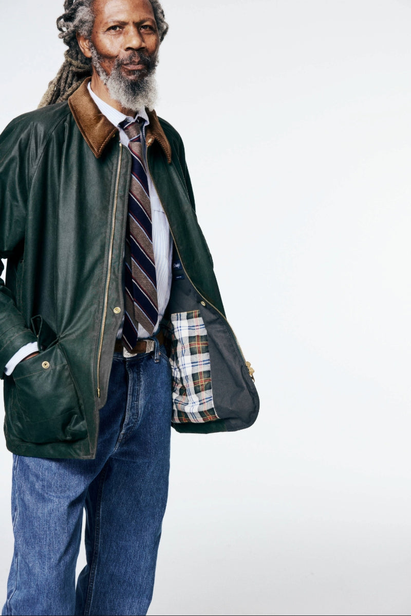 A model wears the Drake's Coverall waxed jacket