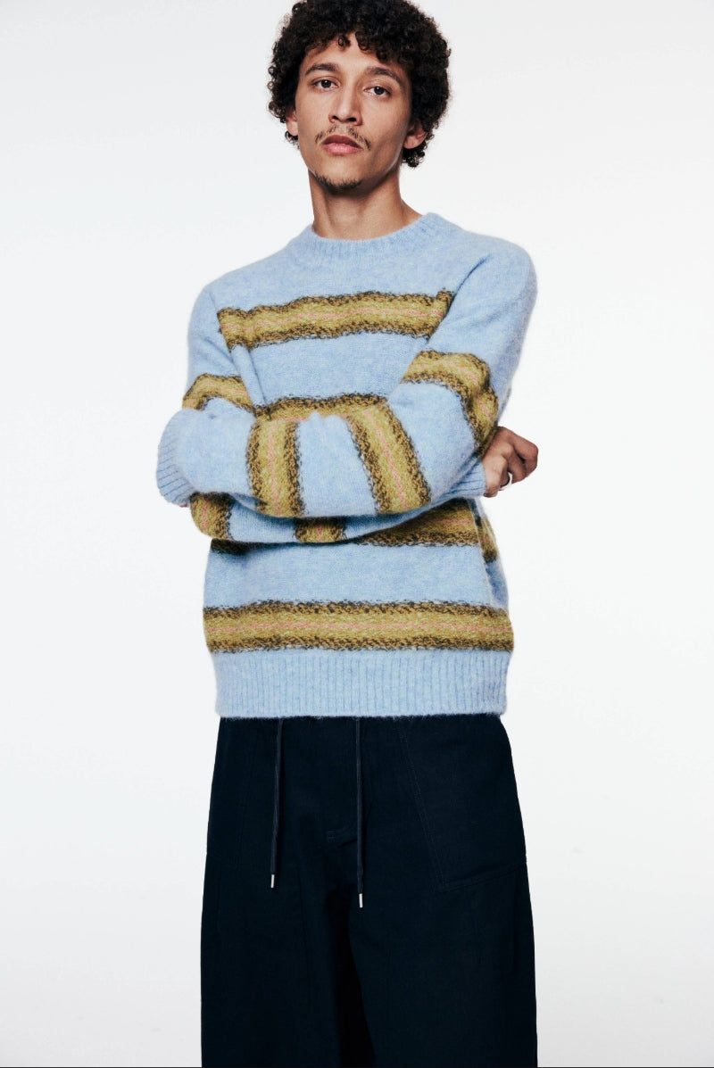 a model wears dries van noten knitwear