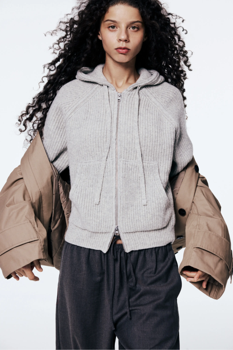 A model wearing Dunst knitwear