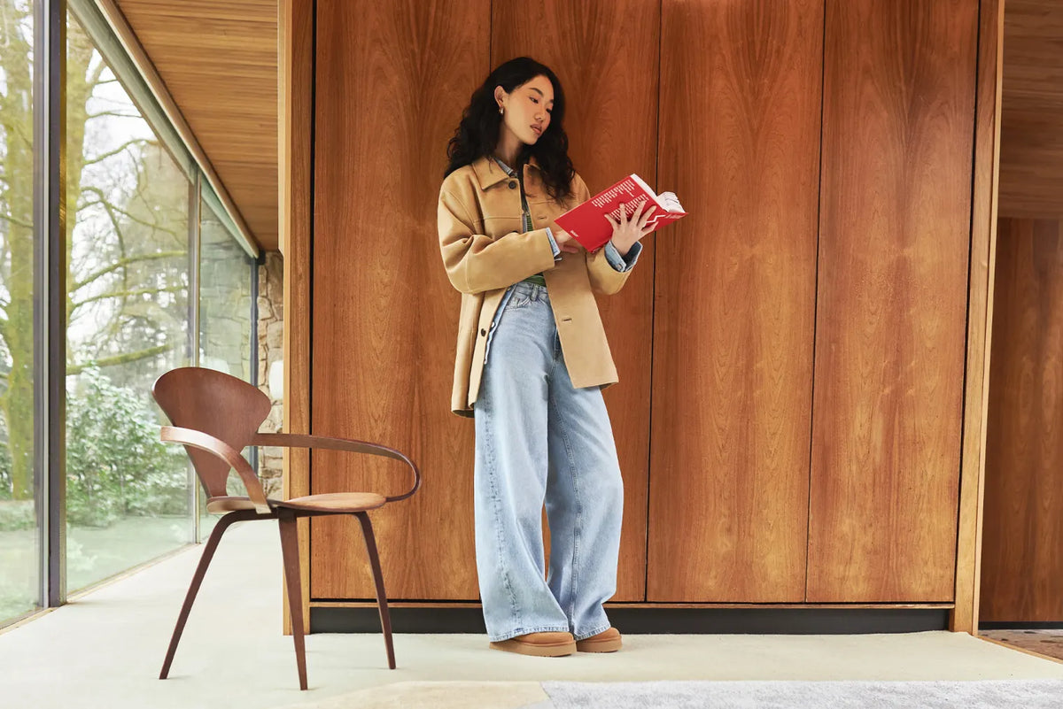 Woman wearing a DUNST blazer, Represent jeans, a Carhartt shirt, and UGG Bea Mary Jane shoes in the END. Spring 2025 Editorial.