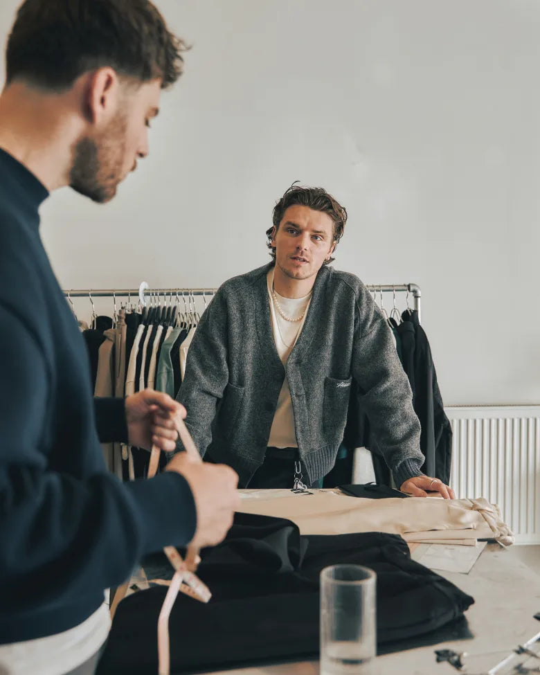 Two men working in a fashion design studio.