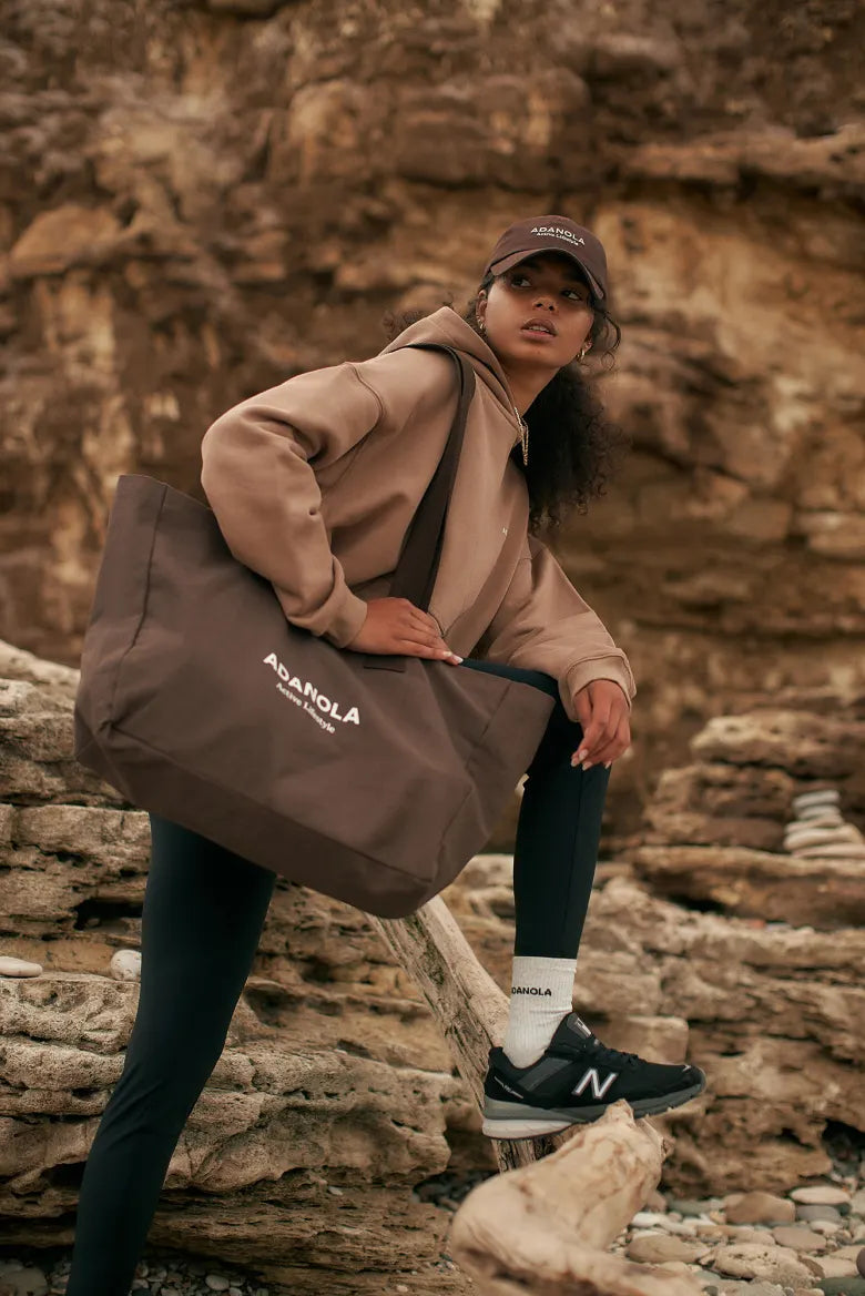 Model wearing Adanola hoodie that's exclusive to END.