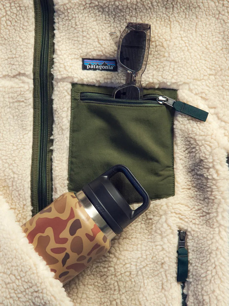 Patagonia fleece with sunglasses and yeti water bottle