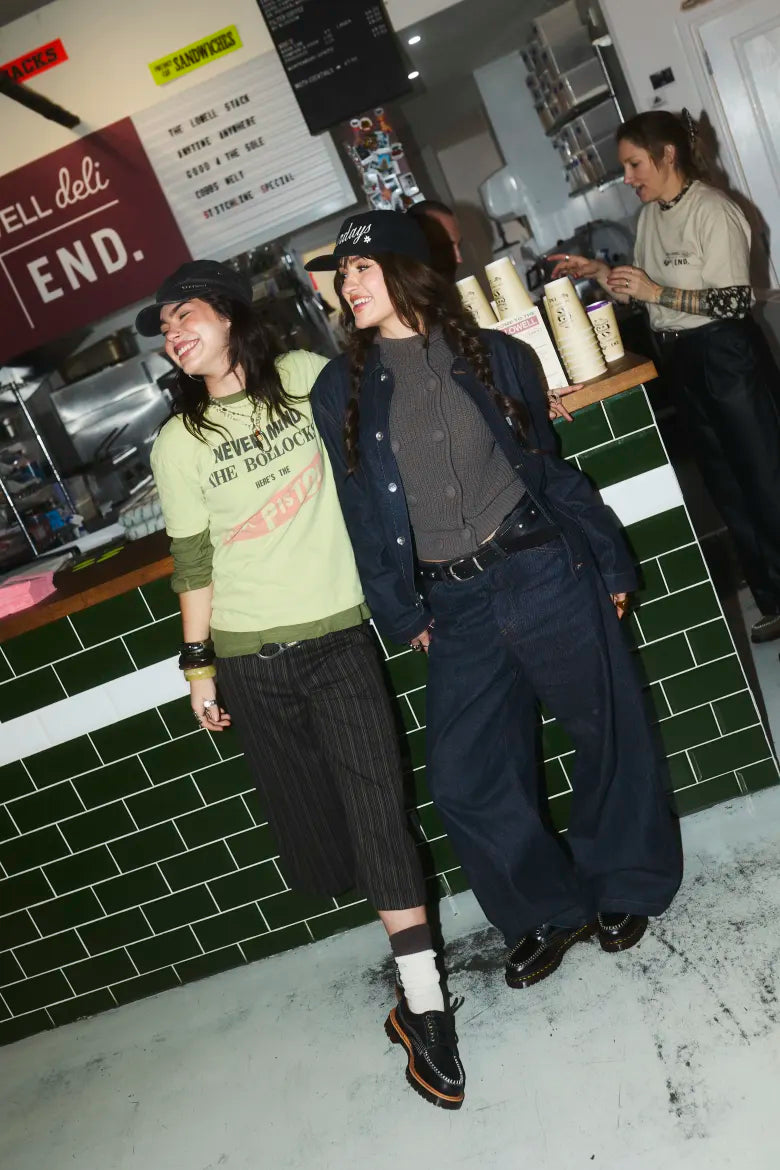 Duo wearing Dr. Martens shoes at Badabing sandwich shop