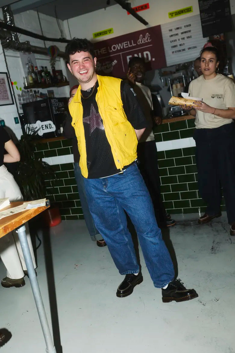 Man wearing Dr. Martens shoes at Badabing sandwich shop