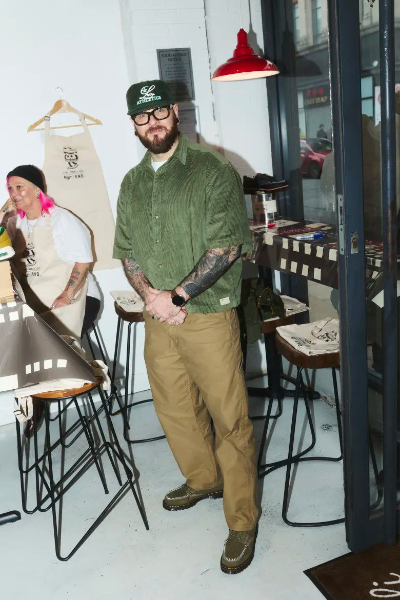 Man wearing Dr. Martens shoes at Badabing sandwich shop