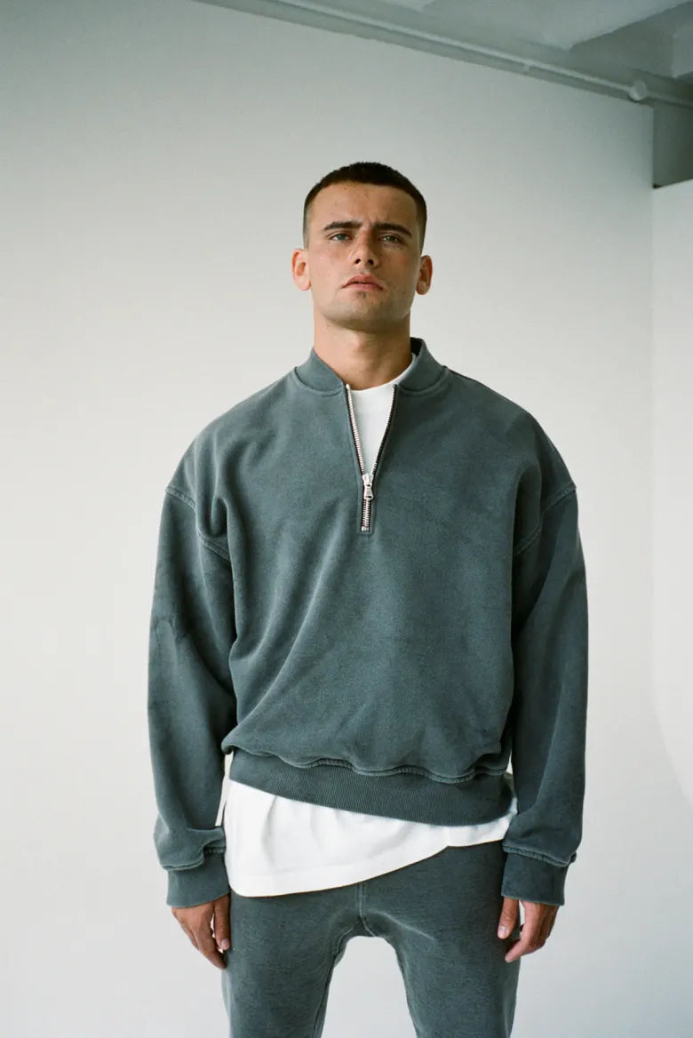 Man wearing Cole Buxton half zip sweatshirt