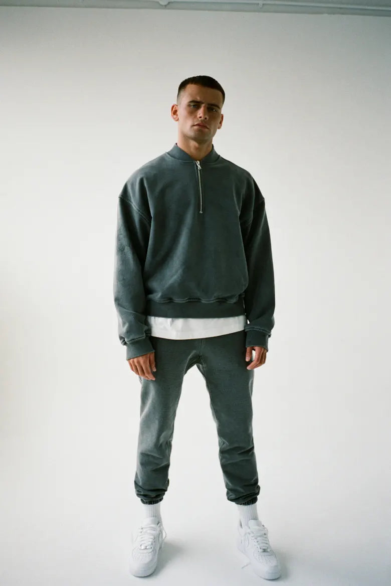 Man wearing Cole Buxton half zip sweatshirt