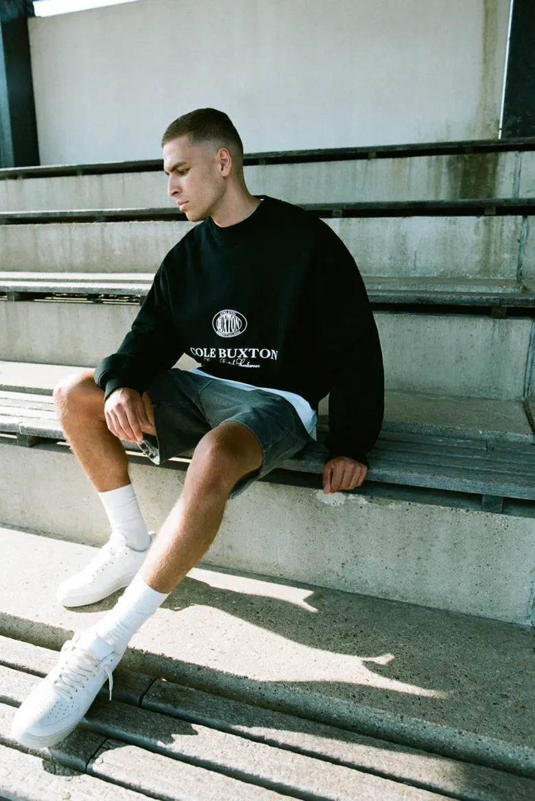 Man wearing Cole Buxton sweatshirt