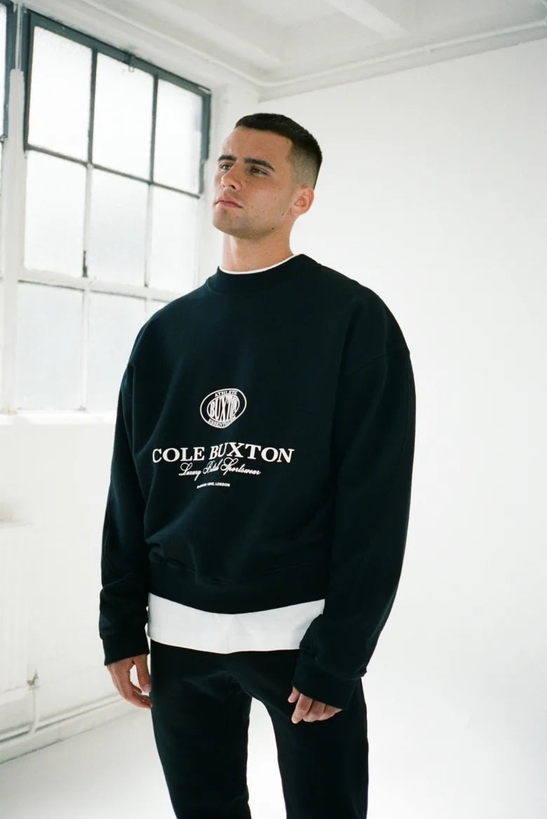 Man wearing Cole Buxton half zip sweatshirt