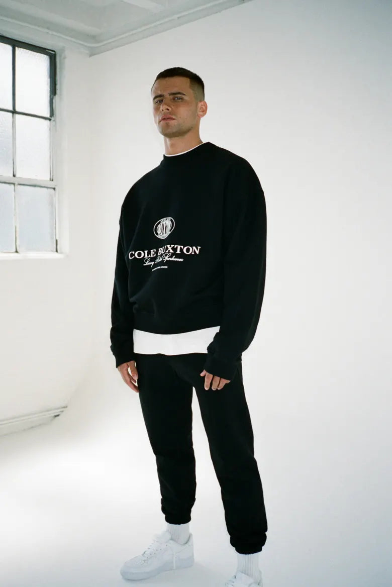 Man wearing Cole Buxton half zip sweatshirt
