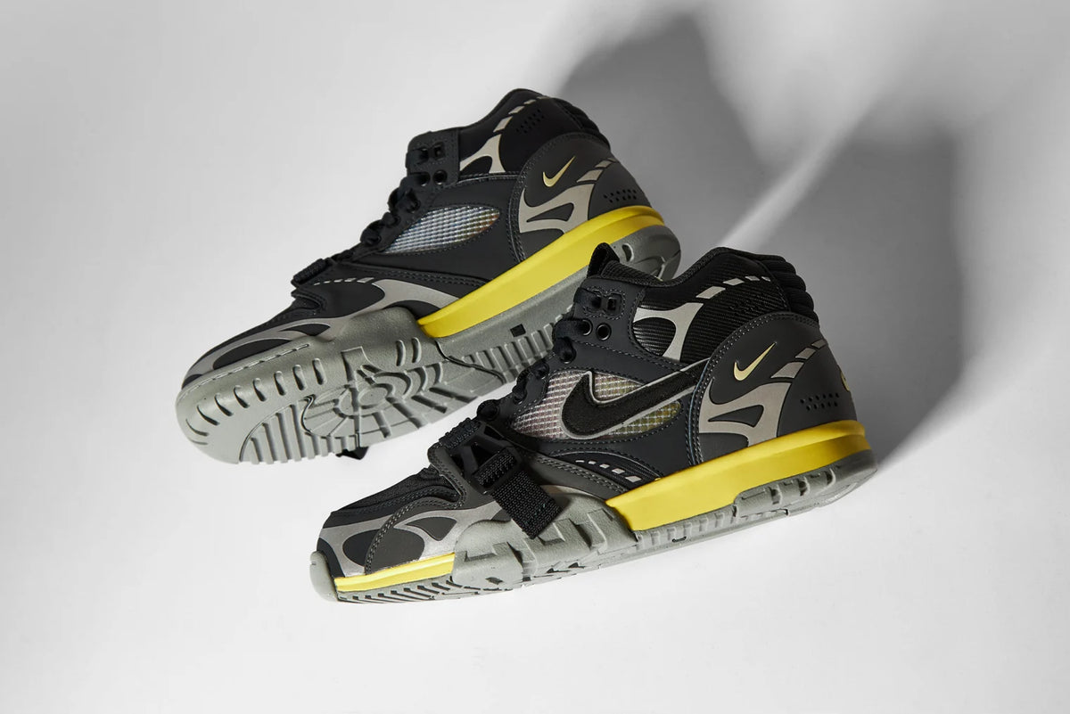 Side view of Nike Air Trainer 1 SP sneakers, showing the silhouette and panel details.