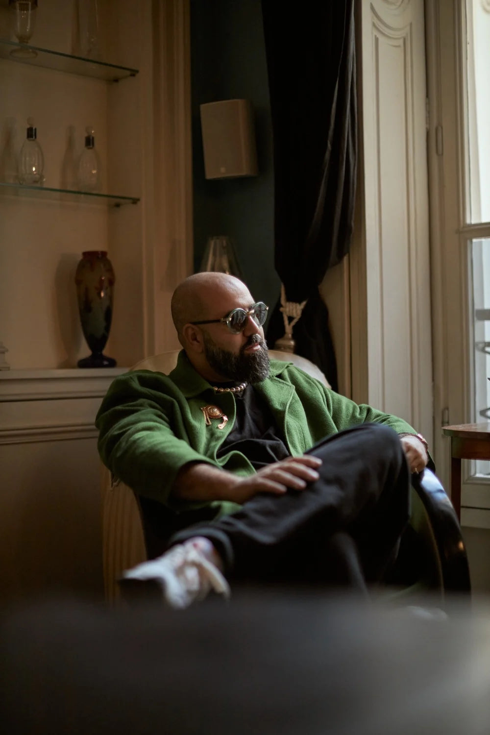 Charaf Tajer sat in a chair looking out the window.