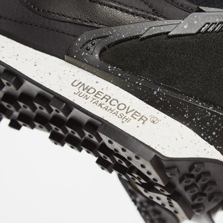 The sole logo of the Nike x Undercover Daybreak sneakers.