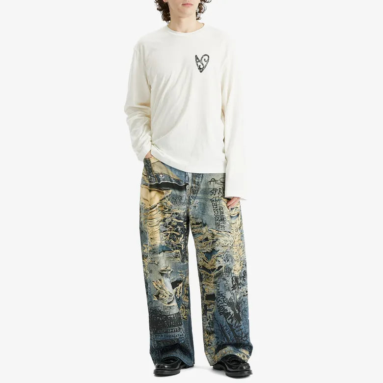 Model wearing Acne Studios Trompe L'Oeil "Torn Scribble" Print Baggy Jeans