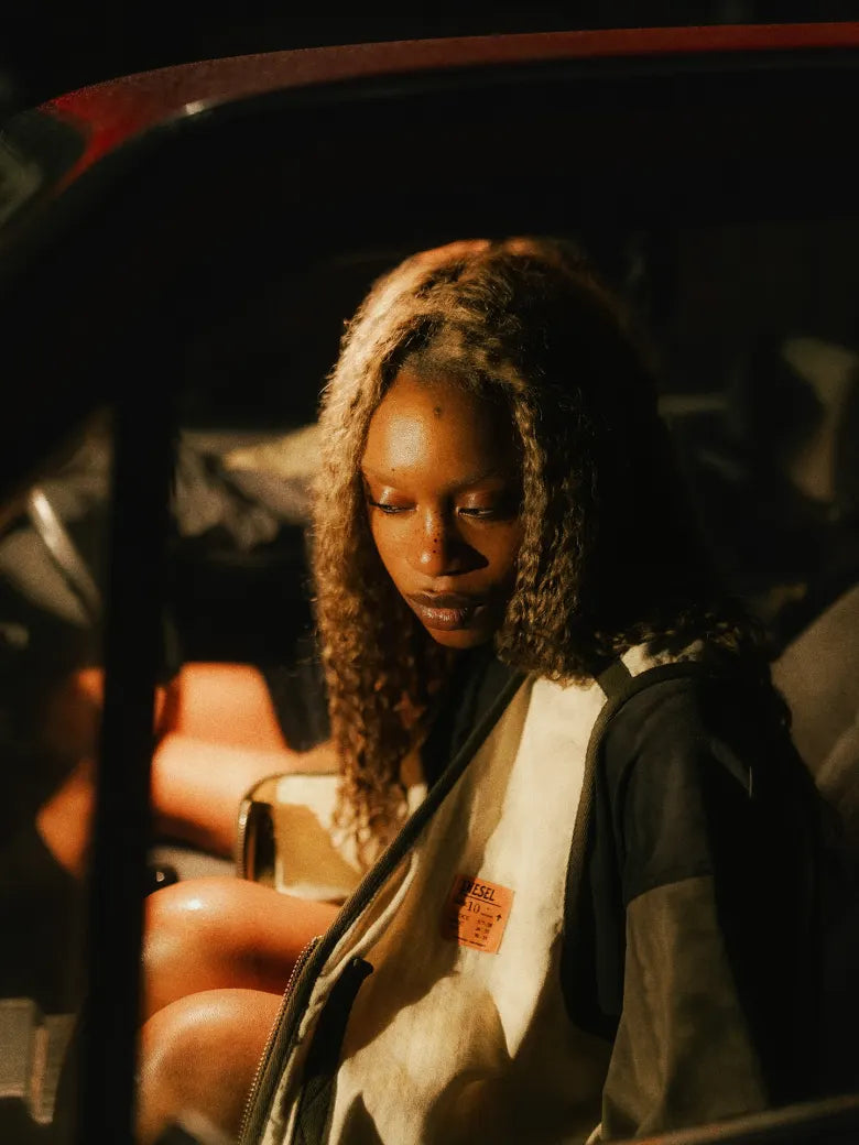 Photoshoot from END. X DIESEL collection featuring models in a red car