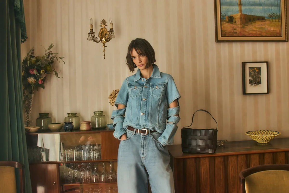 Woman wearing denim jacket and jeans with light wash