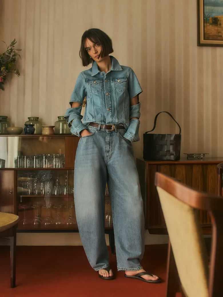 Woman wearing denim jacket and jeans with light wash