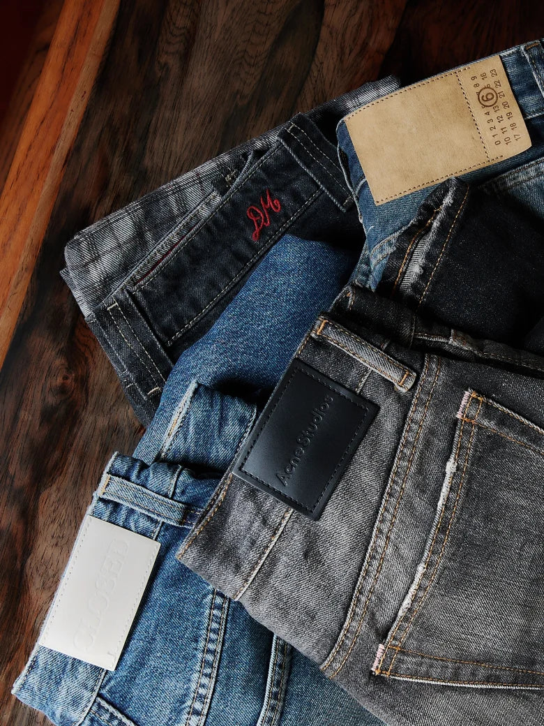 Multiple pairs of jeans with various washes