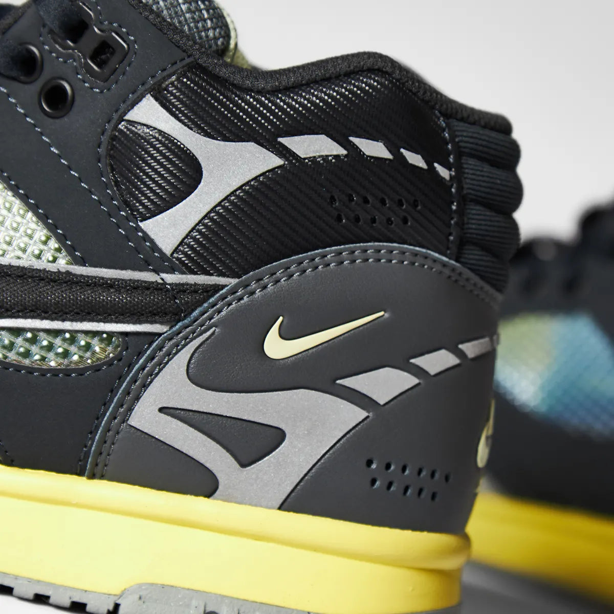 Close‑up of the Nike Air Trainer 1 SP sneaker, highlighting the layered leather panels and heel Nike logo.