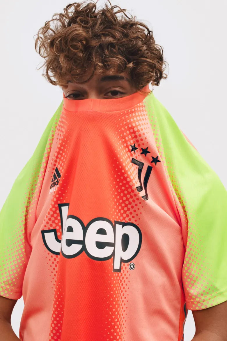 A person wearing a football top from the Palace x Juventus collection.