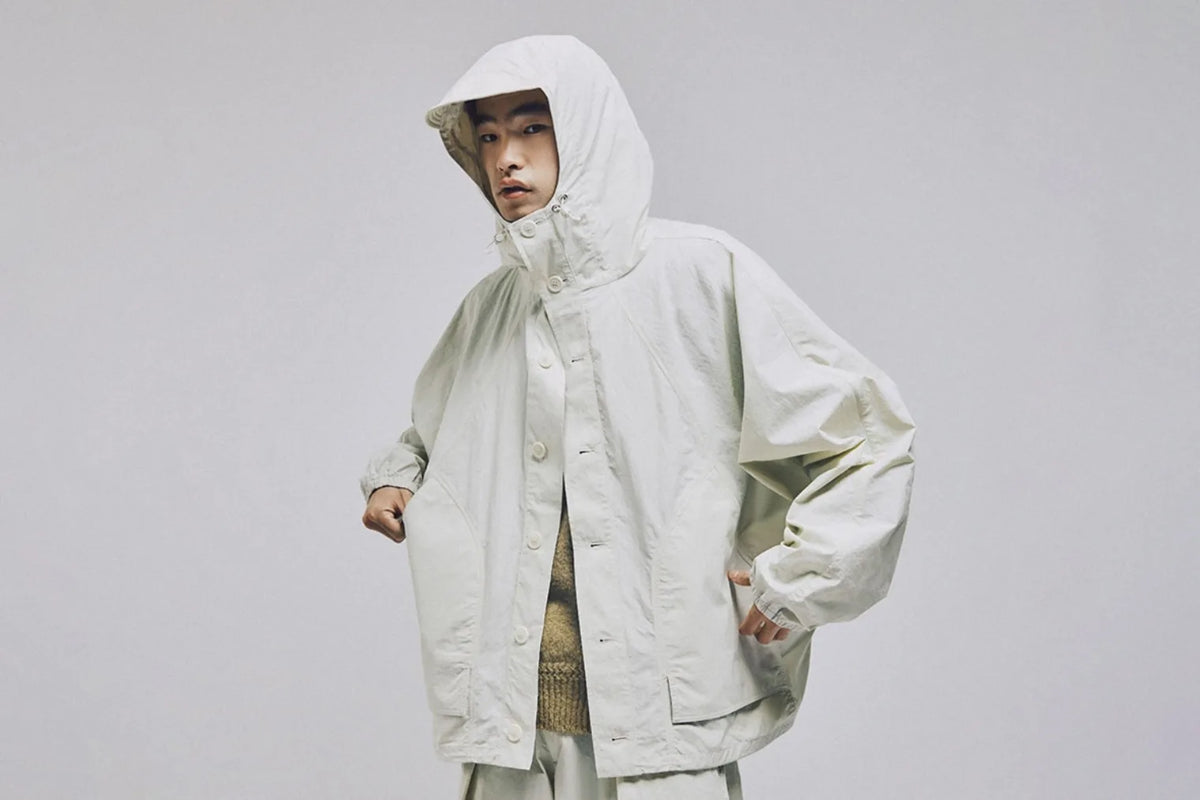 A model wears the YMC Bonehead Jacket in white