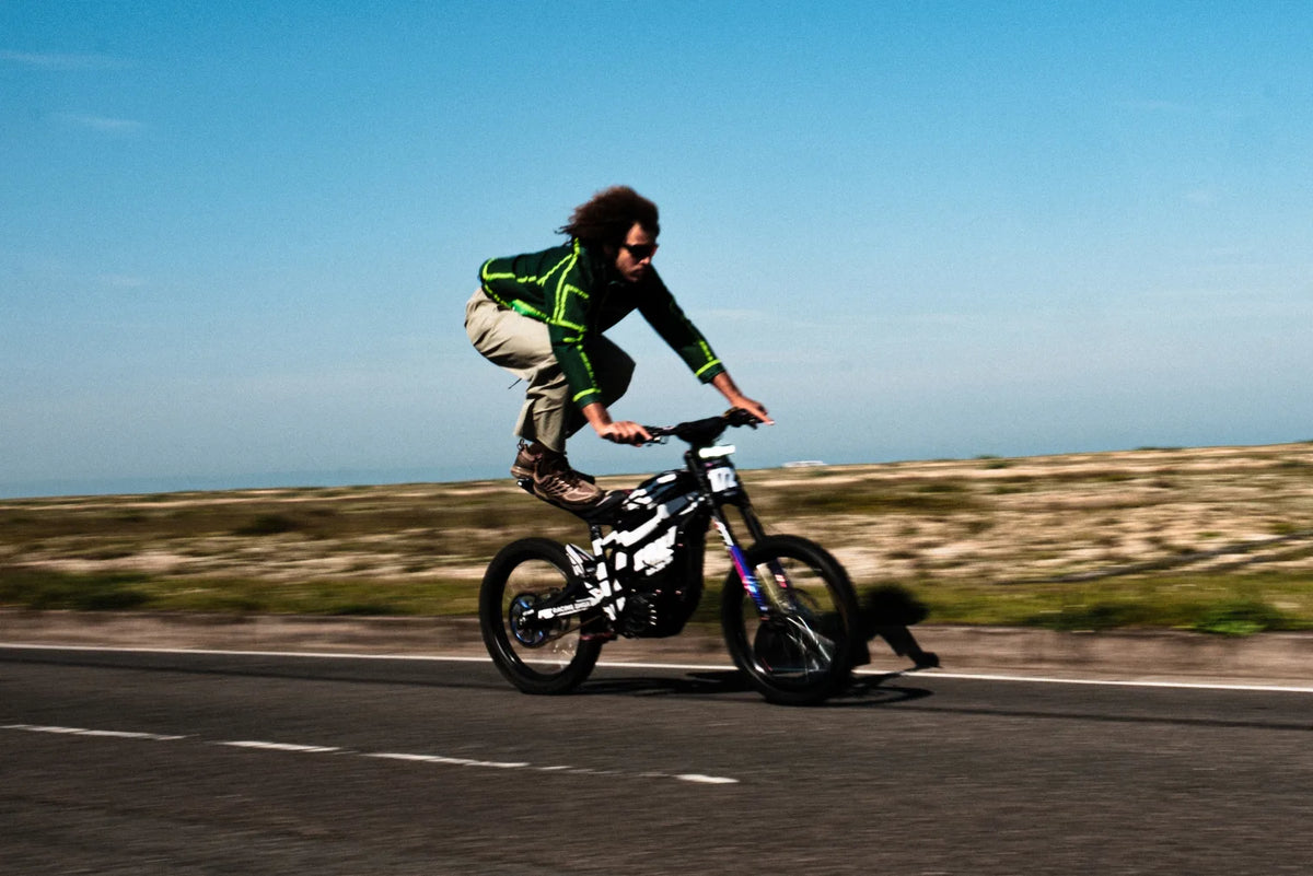 Rapper Joe James riding on a Surron bike