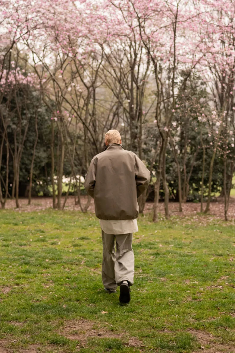 Man walking in park with Dr. Martens’ Jorge Mule on feet