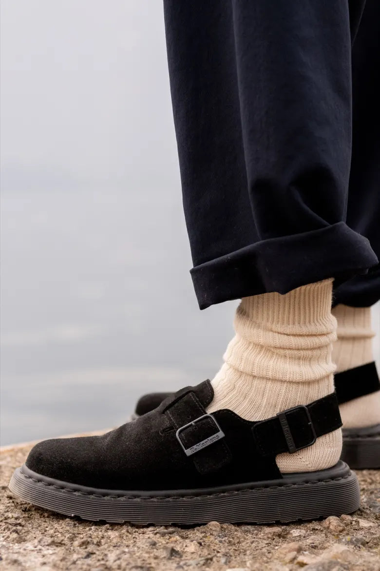 Man with Dr. Martens’ Jorge Mule on feet