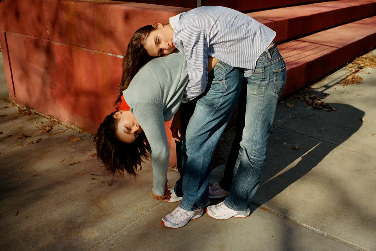 Two people wearing the Salomon x Sandy Liang XT-Whisper sneakers.