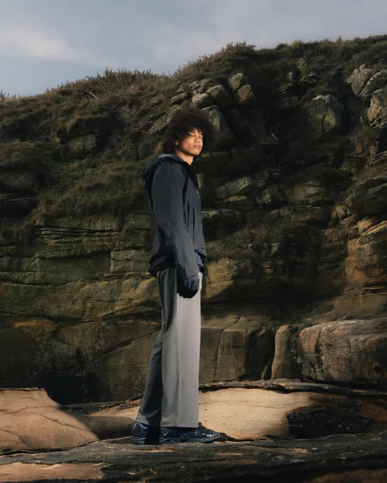 A man wearing the END. x Mizuno Wave Rider 10 sneaker.