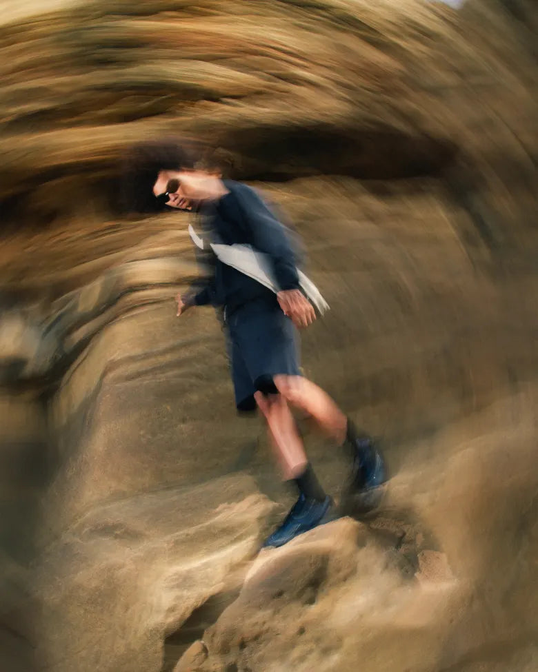 A man wearing the END. x Mizuno Wave Rider 10 sneaker.