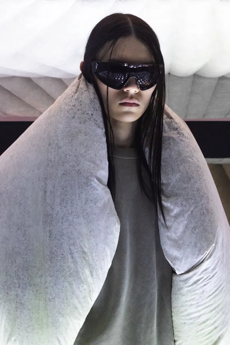A woman in sunglasses modelling the Moncler x Rick Owens collaboration.