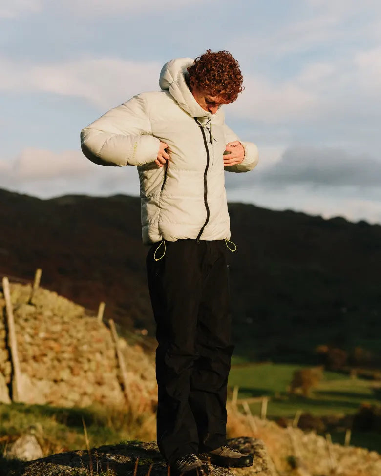 A man wearing END. x Montane outerwear on a hike.
