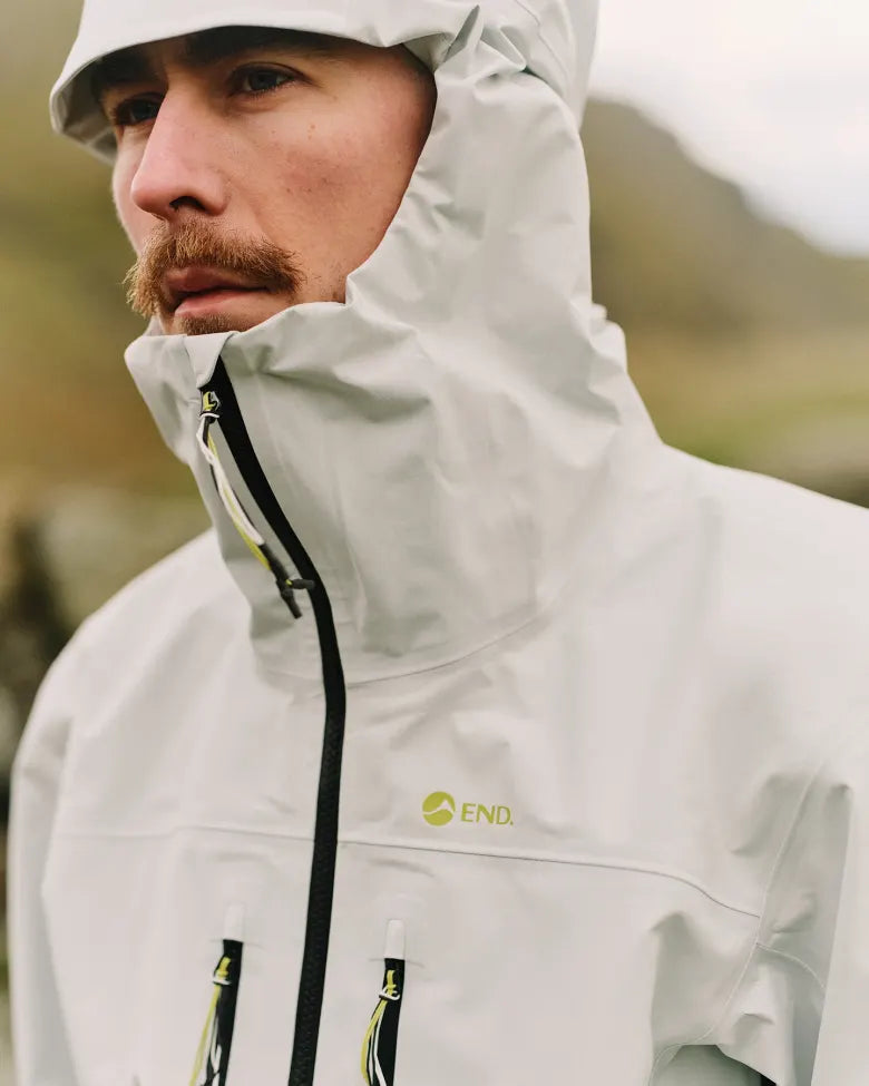A man wearing the END. x Montane waterproof jacket.