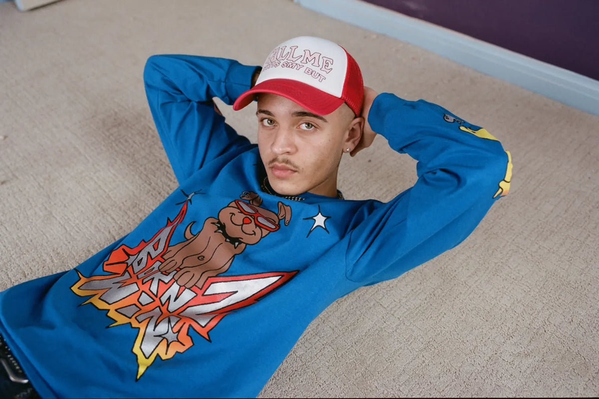 Man wearing t-shirt and cap from Nancy