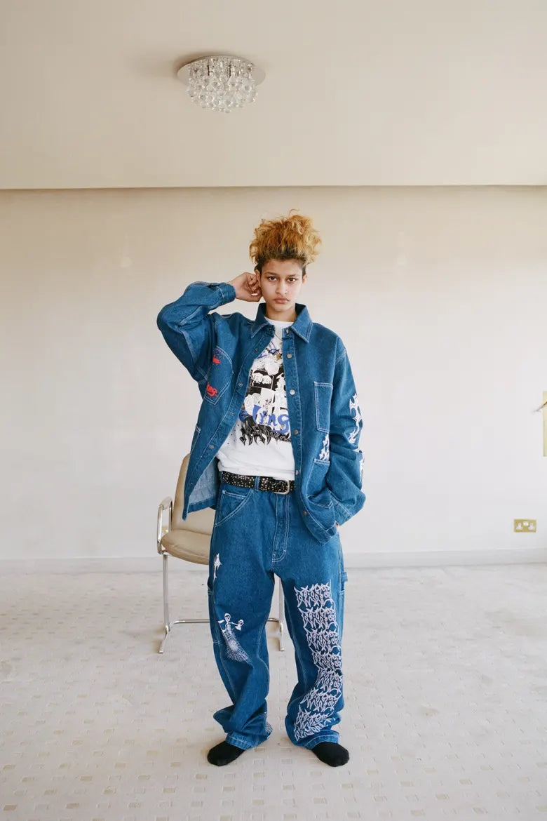 Model wearing jacket and trousers from Nancy