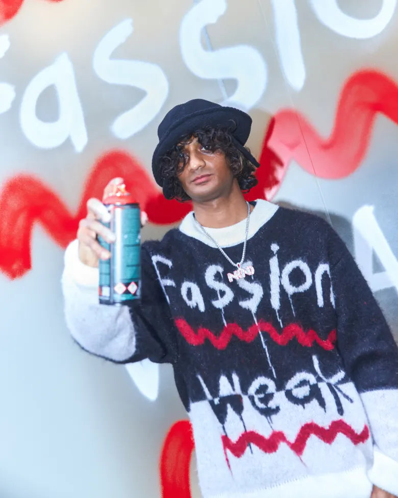 Navinder Nangla spray painting outside END. Soho store