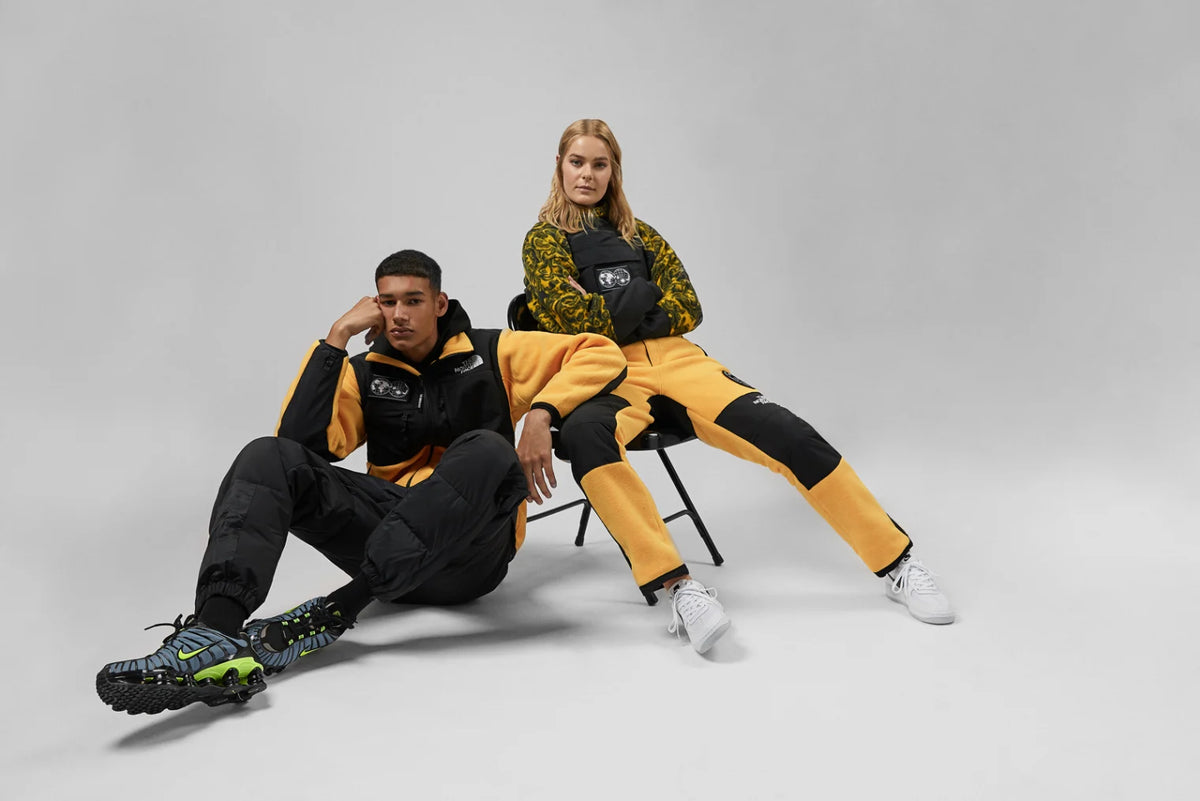 Duo wearing The North Face Seven Summits Denali Jacket and fleece suit