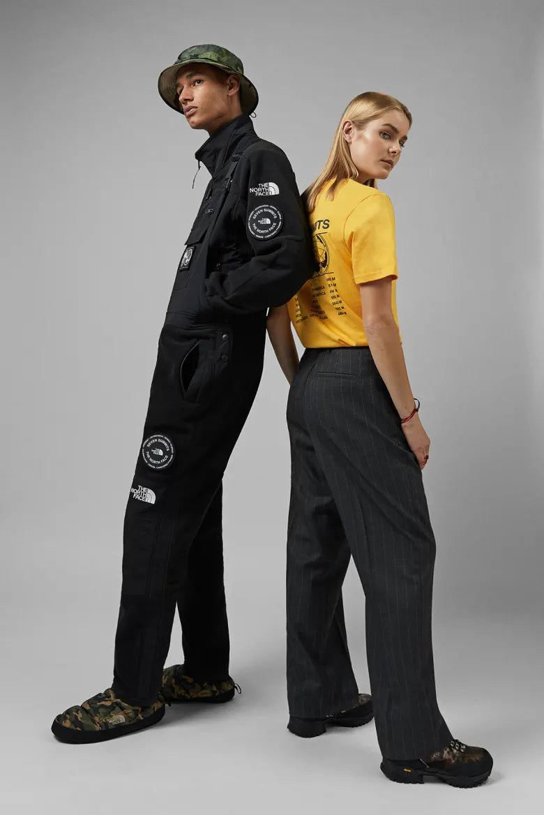 Duo  wearing The North Face Seven Summits fleece suit